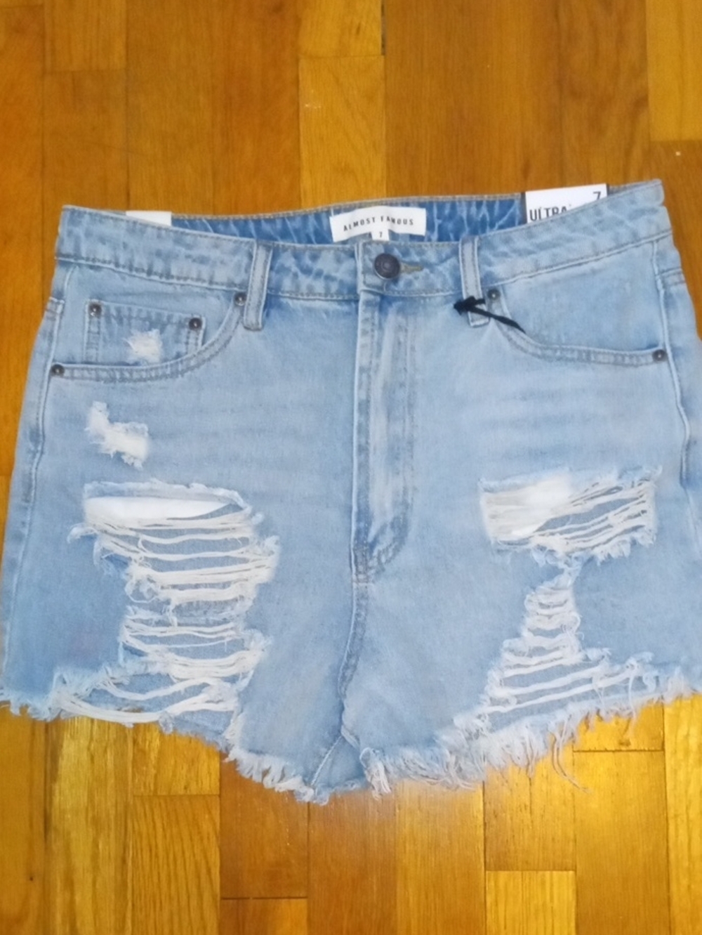 NWT size 7 Almost Famous Light Blue Distressed Denim Shorts, high rise